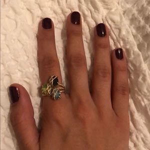 Gold ring with gems (blue, green and purple)